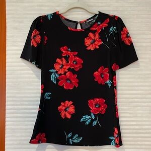 Express black top with red poppy print size medium P2P is 17 inches